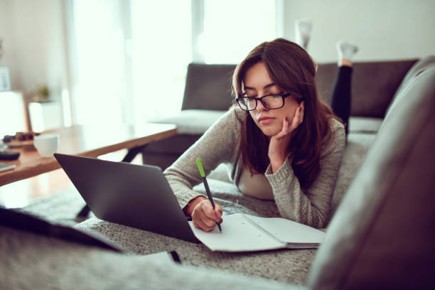 istock Cute Female High School Student Struggling With Mathematics 1446950384