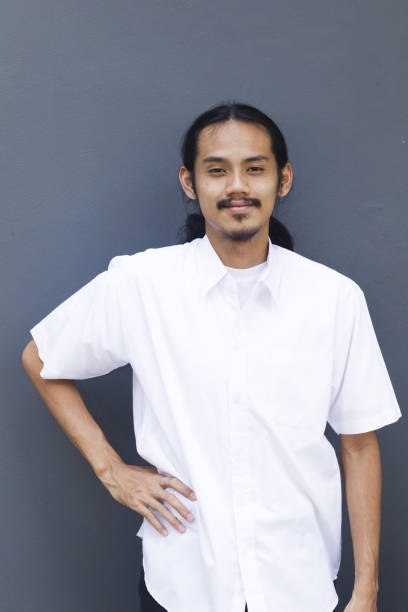 istock Smiling Front portrait of standing Young thai man 1446952293
