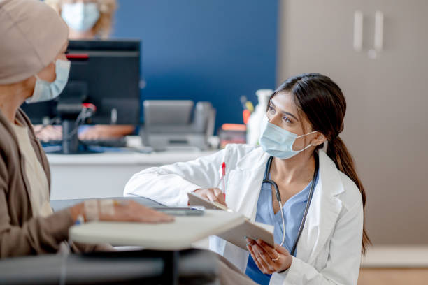 istock Chemotherapy patient discusses with her doctor 1446954350