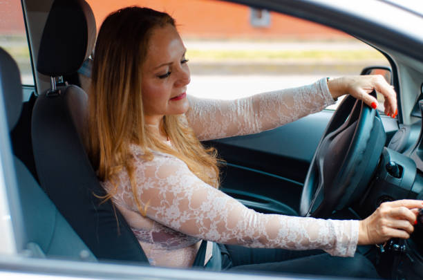 istock Woman inside the car looking away 1446955252