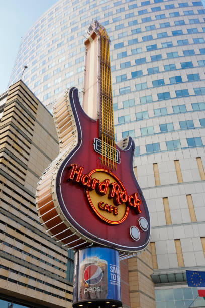 Warsaw, Poland - February 28, 2016: Guitar, this symbol belongs to world famous Hard Rock Cafe net. Its visible against the background of the Golden Terraces commercial and entertainment complex