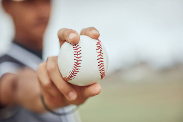 istock Baseball, hands and sports man with ball for exercise game, competition training or practice match. Softball motivation, winner mindset and field baseball player or athlete focus on fitness workout 1446956187