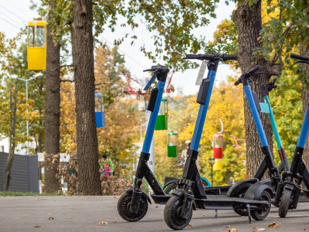 istock Electric Scooters in autumn park with cableway 1446957048