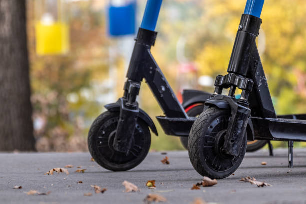 istock Electric Scooters in autumn park with cableway 1446957049