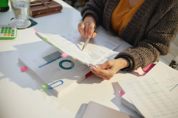 istock tax time. accountant woman working with documents 1446957530