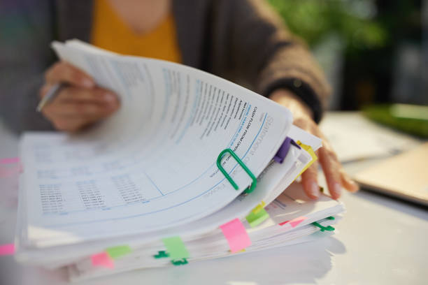 tax time. accountant woman working with documents tax time. accountant woman working with documents. independence document agreement contract stock pictures, royalty-free photos & images