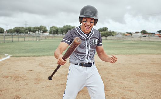 Baseball, man and victory in sports game, celebration or winning on the pitch in the outdoors. Baseball player in sport celebrating match win, point or score for hitting a home run on the field