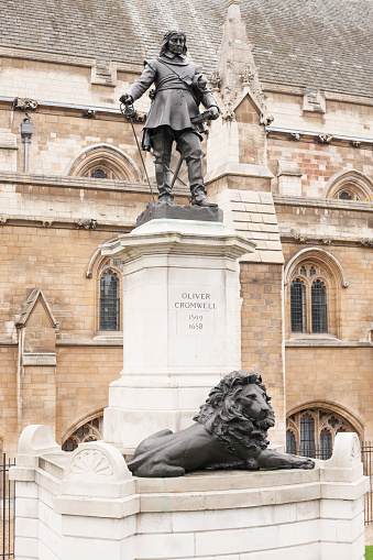 Statue of Oliver Cromwell (1599-1658) outside the Houses of Parliament in London, UK. It was designed by Hamo Thornycroft (1850-1925) and erected in 1899. Oliver Cromwell was an English politician and military officer and is widely regarded as one of the most important statesmen in English history.
