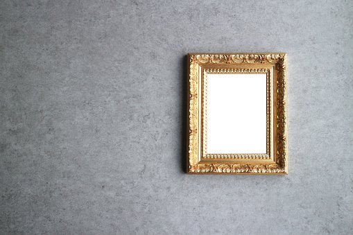 An interior wall with a gold frame and room for your image.