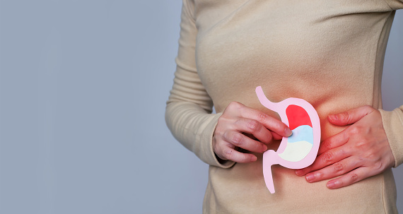 Digital medical illustration: X-ray of human digestive system, with large intestine highlighted. Anterior (front) view. This is a rendering from a digital model.