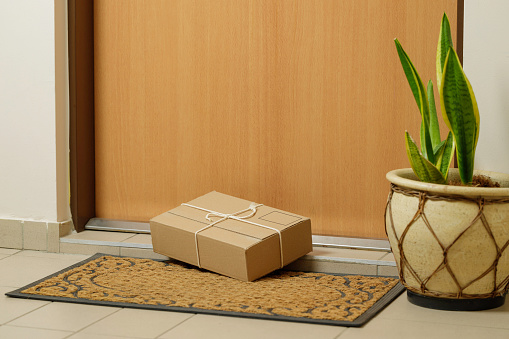 parcel lying in front of the door to the apartment