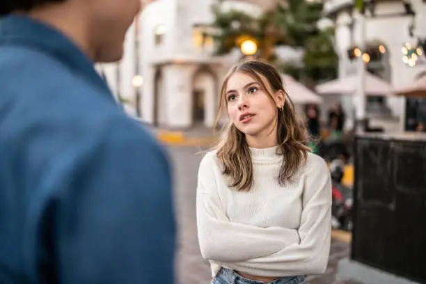 Photo of Young couple having an argument outdoors