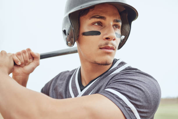 istock Baseball player, focus and sports man with bat ready for game competition, exercise workout or practice match. Softball motivation, winner mindset or fitness athlete ready for baseball field training 1446962457