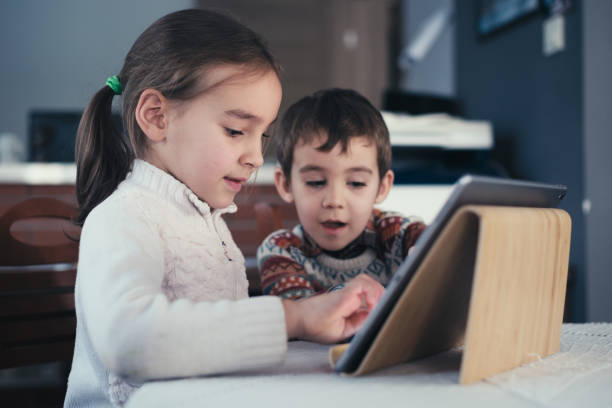 istock Children playing video game on digital tablet 1446963251