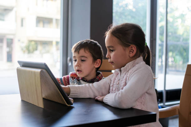 istock Children playing video game on digital tablet 1446963312