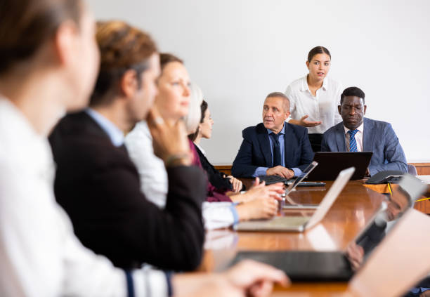 istock Group of business people discussing work plan in conference room 1446963726