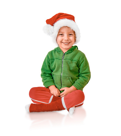 Smiling Child Wears Santa's Hat