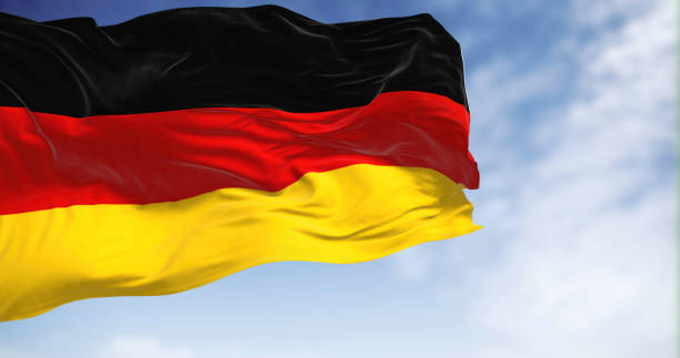 istock Germany national flag waving in the wind on a clear day. 1446967253