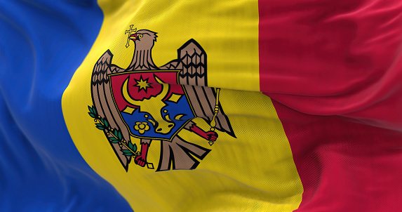 Close-up view of the Moldova national flag waving in the wind. Republic of Moldova is a landlocked country in Eastern Europe. Fabric textured background. Selective focus. 3d illustration