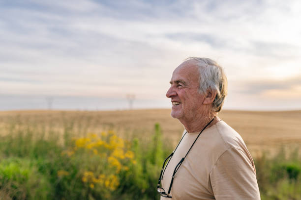 istock Smiling farmer in the plantation 1446970075