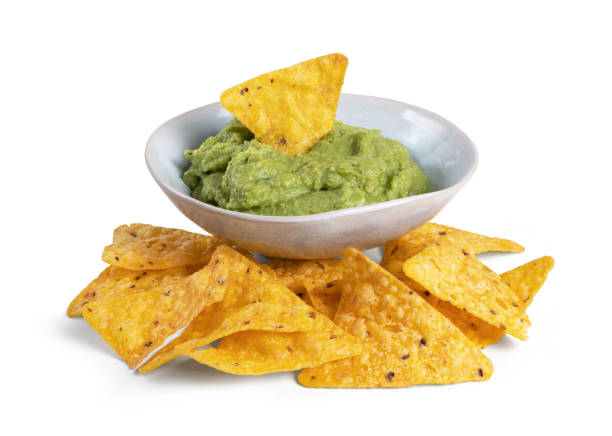 istock bowl with guacamole and nachos isolated on the white background 1446970204