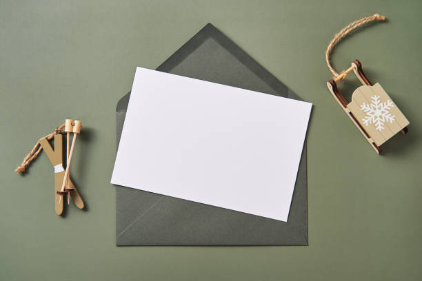 istock Christmas greeting card mockup, blank postcard with craft paper envelop. 1446970844