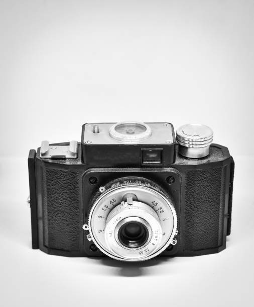 istock Vintage film camera isolated on white with a copy space 1446972420