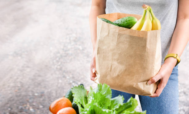 istock woman with grocery bag 1446974050