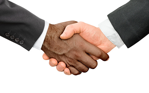 white and African American businessman handshake on white isolated background