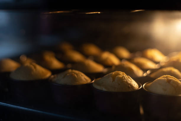 istock Baking cupcakes in oven. Homemade cupcakes. Selective focus. 1446974205