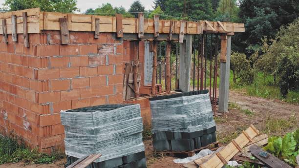 istock Red Brick Detached House Construction Site with Ceiling Formwork Supported by Steel Telescopic Bearer 1446975780