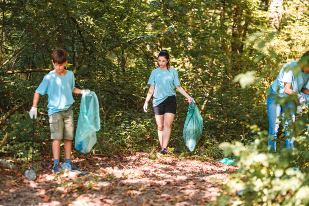 istock Sunny Day, Active Multiracial Group Cleaning Nature 1446977705