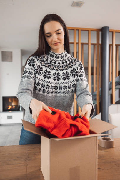 istock A woman wrapping a Christmas present 1446980443