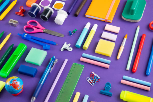 istock School Supplies on Purple Background 1446981973
