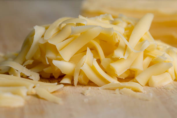 istock Sliced and grated hard cheese with cashew nuts 1446984610