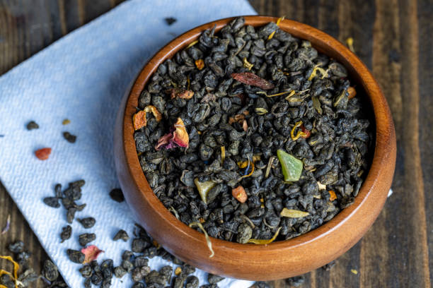 istock Dried large-leaf green tea with pieces of fruit 1446984649
