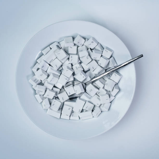 istock Keyboard keys /  letters on plate with the word eat forming in spoon 1446985236