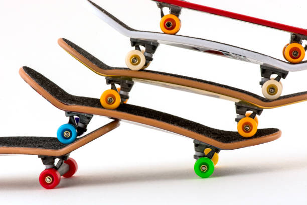 istock Office entertainment. Fingerboard  a skateboard on white background 1446987924