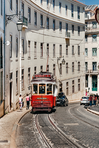 Portugal, Tram  in Lisbon. This unofficial tourist line has the most picturesque route. It goes through the narrow streets. Editorial image vertical photo