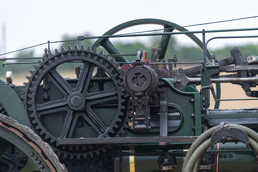 Tarrant Hinton.Dorset.United Kingdom.August 25th 2022.Close up of the cogs and pulleys on a restored traction engine