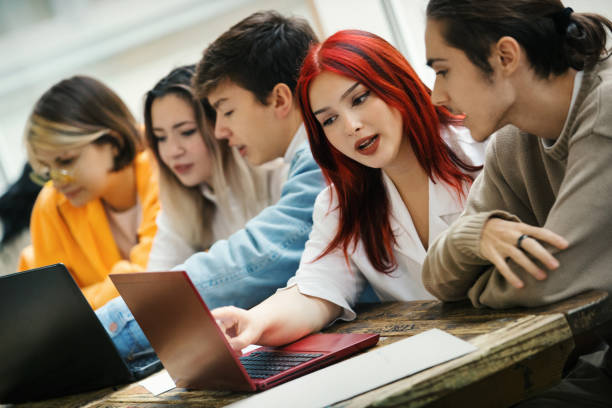 istock Highschool students on a break in  the hallway. 1446999041