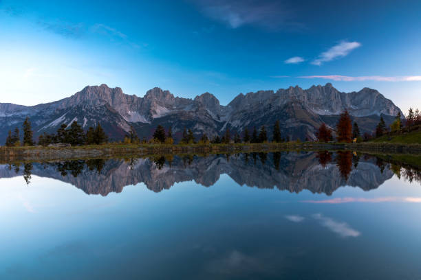istock Wilder Kaiser mountains reflected in lake Astbergsee 1447004308