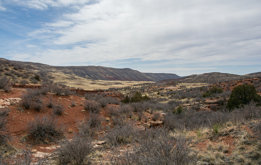 Rolling hills of red dirt in the winter of Colorado