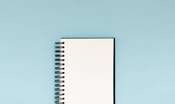 istock White blank notebook to plan future goals, challenges and achievements. Flay lay perspective with copy space 1447004758