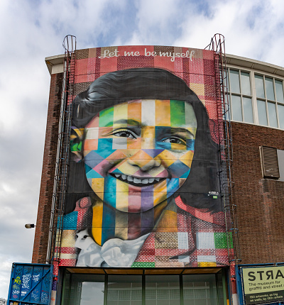 Amsterdam, Netherlands - October 15, 2022: A picture of the Let Me Be Myself colorful mural, depicting Anne Frank, created by Eduardo Kobra in 2016.