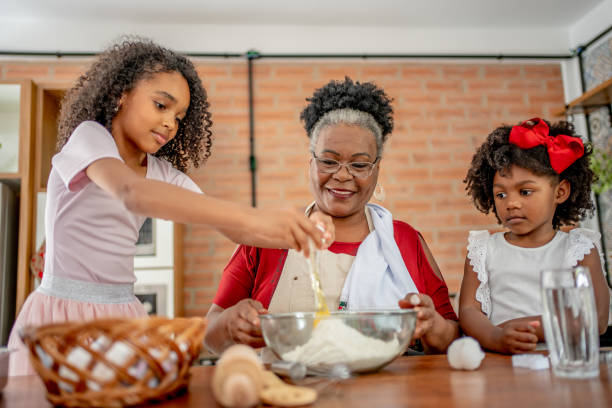 istock Grandma and granddaughters making Christmas cookies 1447009328