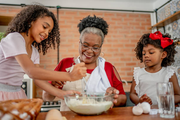istock Grandma and granddaughters making Christmas cookies 1447009353