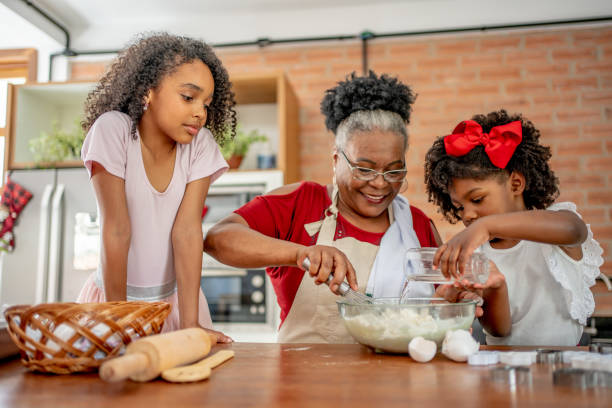 istock Grandma and granddaughters making Christmas cookies 1447009377