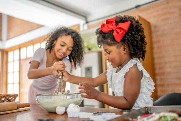 istock Grandma and granddaughters making Christmas cookies 1447009407