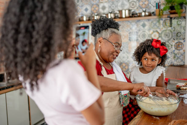 istock Grandma and granddaughters making Christmas cookies 1447010042